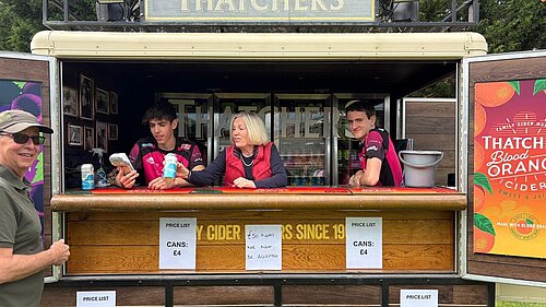 Tessa in a thatchers stand